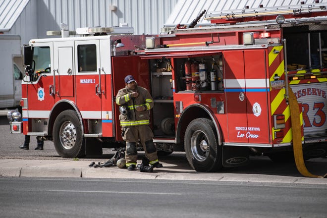 Las Cruces Fire Department firefighters respond to a fire that broke out at Junk and Disorderly next door to High Desert Outfitters on Amador Avenue in Las Cruces on Wednesday, Feb. 23, 2022.