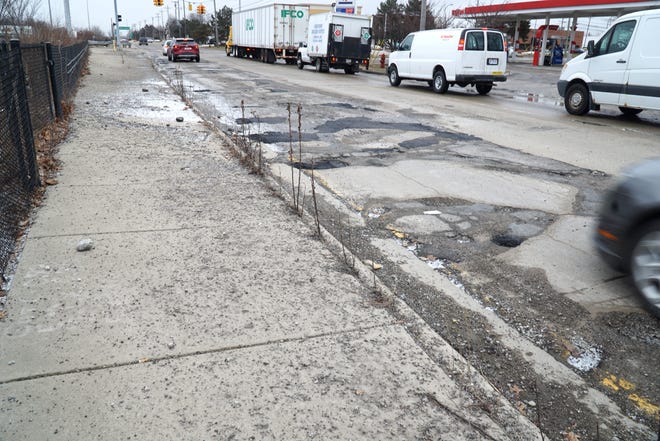    A lot of potholes and asphalt patches greet drivers along Schoolcraft Road near Merriman. The City of Livonia is planning on doing some major work to fix the intersection in 2022.                            