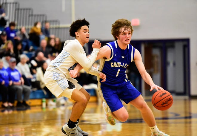 Croswell-Lexington's Trey Kolakovich dribbles down the court during a game last season. He scored 10 points in the Pioneers' 59-8 win over Marysville on Tuesday.