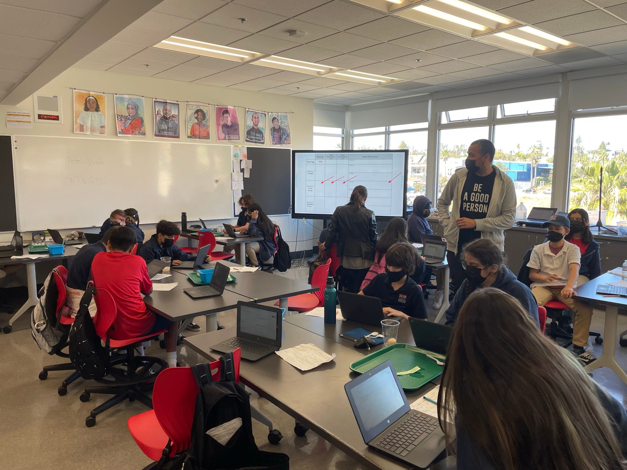 Eric Cross (middle) teaches seventh-grade science at Einstein Middle School in San Diego. The school was eligible for a federal Paycheck Protection Program loan, but school officials turned it down because the state of California did not cut any funding to public schools.