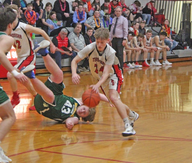 Tekonsha's Chase Hewlett (24) weaves around a fallen opponent on his way to a buzzer beating teardrop Wednesday night