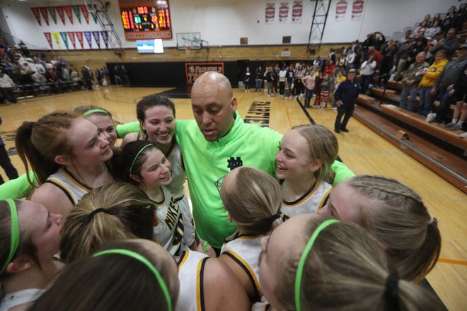 Notre Dame High School's head coach Corey Stephens talks with his players following the team's 83-22 Class 1A regional final victory over English Valley Wednesday Feb. 23, 2022 at Fairfield High School.