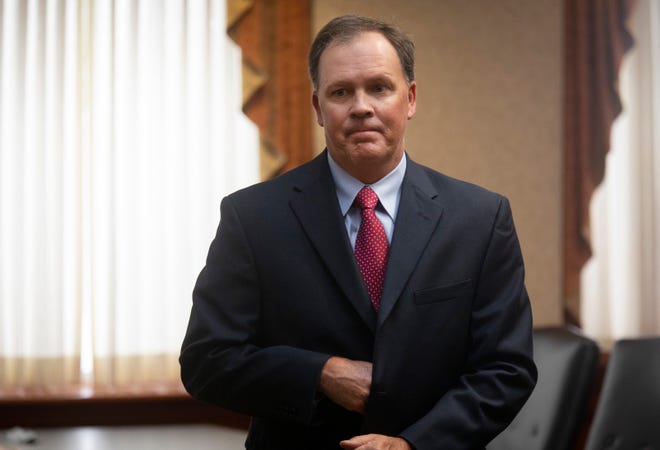 Roger Reynolds, Butler County auditor, can remain in public office as he faces charges of bribery and unlawful interest in a public contract, along with unlawful use of authority and conflict of interest, an commission appointed by the Ohio Supreme Court ruled Tuesday.