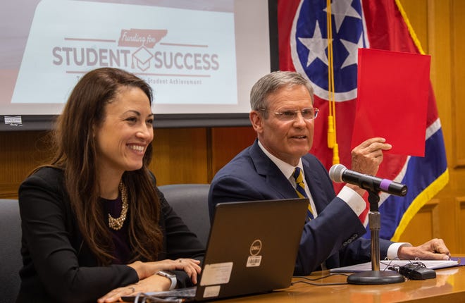 Governor Bill Lee mentions how the size of the Tennessee Investment in Student Achievement formula can fit inside a binder before Education Commissioner Penny Schwinn introduces the proposal at the Tennessee State Capitol during a press conference in Nashville, Tennessee , on Thursday, February 24.  2022.