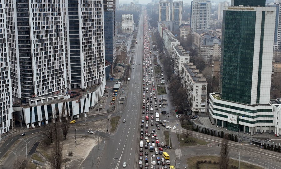 Traffic jams are seen as people leave the city of Kyiv, Ukraine, Thursday, Feb. 24, 2022. Russian President Vladimir Putin on Thursday announced a military operation in Ukraine and warned other countries that any attempt to interfere with the Russian action would lead to "consequences you have never seen."