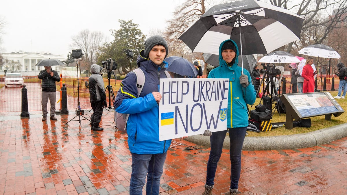 Pro-Ukraine demonstrators at the White House on Feb. 24, 2022, before President Joe Biden addresses the nation after Russia invaded Ukraine.