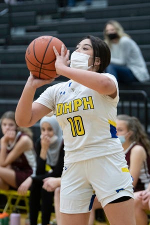 Dolores Huerta's Lanae Guerra shoots for three during a matchup with Thomas MacLaren School on Thursday, Feb. 24, 2022.