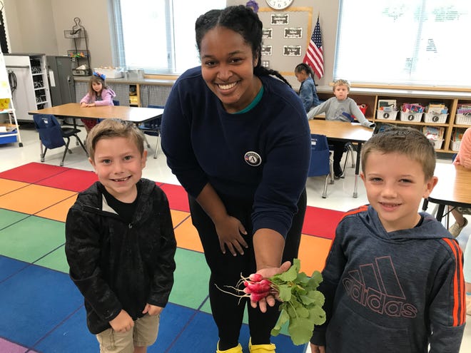 Tiffany Knight (center), a FoodCorps service member, serves at James Tate Elementary and Oliver Springs Elementary for the 2021-2022 service year in Van Buren.