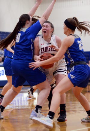 Sarah Cooperrider is trapped between Vincent Warren's Addy Smith, left, and Laura Frazee during Fairfield Union's 43-38 loss to Vincent Warren in a Division II district final on Friday night at Chillicothe Southeastern. The Falcons finished a 22-3 season.