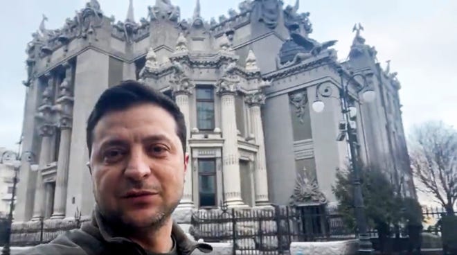 In this photo provided by the Ukrainian Presidential Press Office, Ukrainian President Volodymyr Zelenskyy speaks to the nation via his smartphone in the center of Kyiv, Ukraine, Saturday, Feb. 26, 2022. Russian troops stormed toward Ukraine’s capital Saturday, and street fighting broke out as city officials urged residents to take shelter. The country's president refused an American offer to evacuate, insisting that he would stay. “The fight is here,” he said.