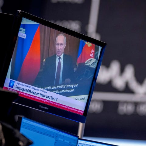 Russia's President Vladimir Putin appears on a tel