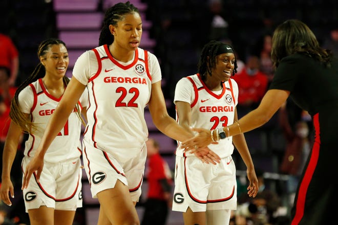 Georgia celebrates after winning an NCAA women's college basketball game between Texas A&M and Georgia in Athens, Ga., on Sunday, Feb. 27, 2022. Georgia won 67-58.