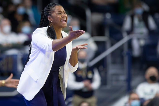 Notre Dame head coach Niele Ivey questions a call during the second half of an NCAA college basketball game against Louisville on Sunday, Feb. 27, 2022, in South Bend, Ind. (AP Photo/Robert Franklin)
