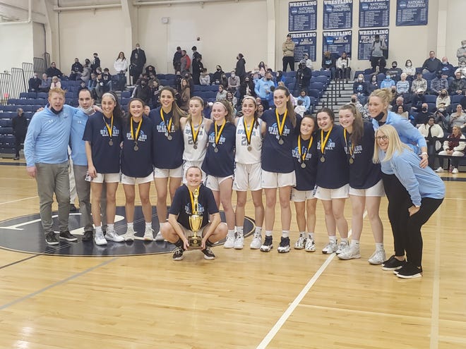 The Sparta girls basketball team celebrates winning the 2022 Hunterdon/Warren/Sussex Tournament on Saturday, Feb. 26, 2022, at Centenary University. The Spartans took down Pope John, 60-43, in the final.