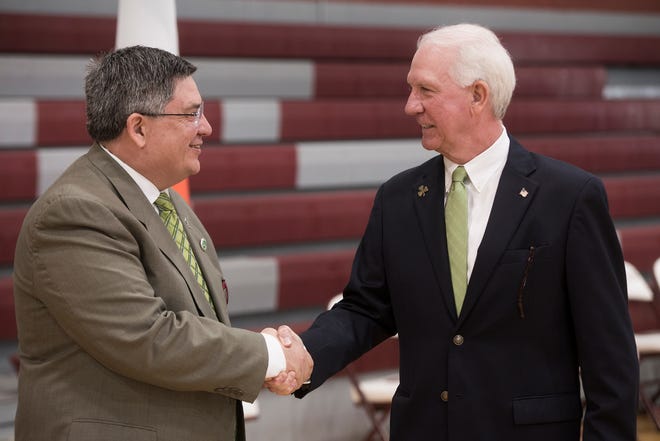 Savannah St. Patrick's Day Parade Committee General Chairman John Fogarty, left, shakes hand with newly elected Grand Marshal Danny Powers on Sunday at the Benedictine Gym. 