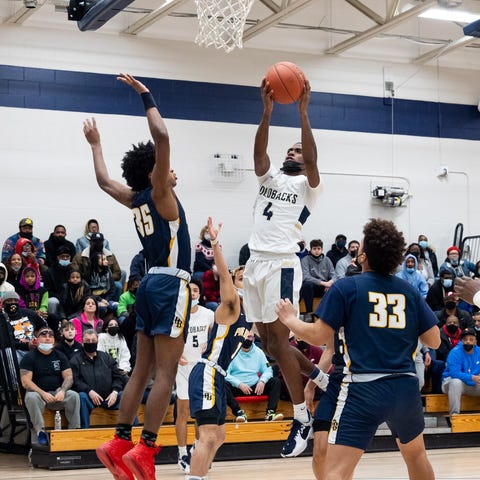 Newburgh Free Academy's Jah'Likai King (4) goes up