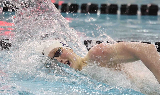 St. Xavier's Thackston McMullan competes in the 200-yard freestyle at the OHSAA State Swimming and Diving Championships in Canton, Ohio, Saturday, Feb. 26, 2022.