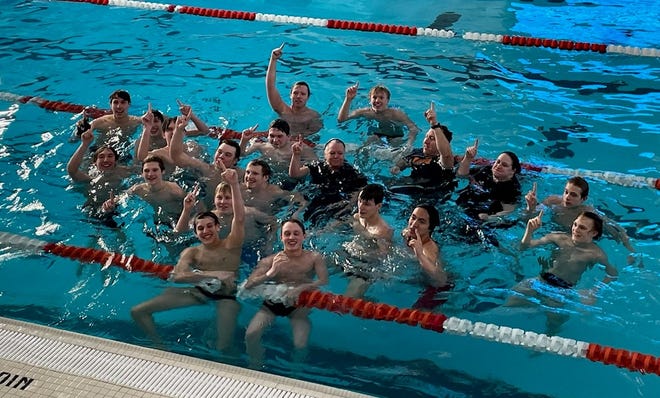 Pinckney celebrates its victory in the SEC White swimming and diving met on Saturday, Feb. 26, 2022 at Jackson.