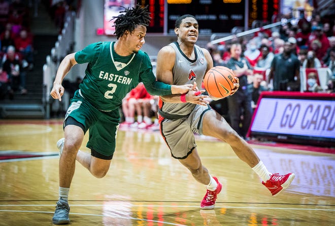 Ball State's Demarius Jacobs drives on an Eastern Michigan defenders during their game at Worthen Arena Saturday, Feb. 26, 2022. Ball State beat Eastern Michigan 75-64.