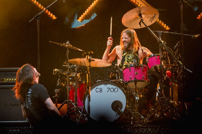 Foo Fighters singer and guitarist Dave Grohl, left, and drummer, Taylor Hawkins, right, perform at Innings Festival 2022 in Tempe Beach Park in Tempe, Arizona.