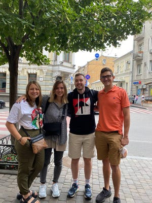 Philp Kopatz, right, a 2019 Walsh University graduate, is a frequent visitor to Ukraine. Kopatz, pictured here with some of his friend in Kyiv, is deeply concerned about friends there who send him constant updates about the Russian attack.