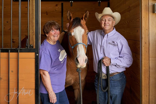 Bill and Marcia Shearer, co-owners of Whispering Grace Horses & Freedom Farm outside Massillon, are shown with Heavenly Dreamer.