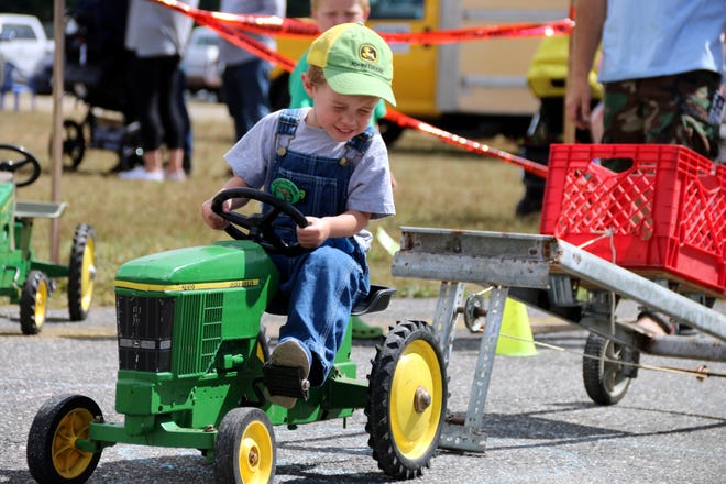 John Fiore gives it his all in the kiddie tractor pull at a previous Sterling Fair.  John competed in the 3-year-old and 4-year-old division.