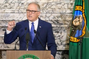 Washington Gov. Jay Inslee gives his annual State of the State address, Tuesday, Jan. 11, 2022, at the Capitol in Olympia, Wash.