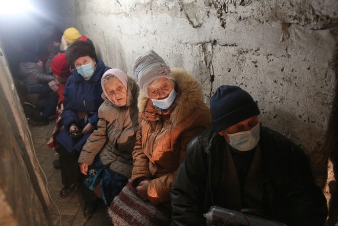 Residents of Severodonetsk, Donetsk region, wait hidden in their basement during heavy shelling by Russian forces and Russia-backed separatists on Feb. 28, 2022.