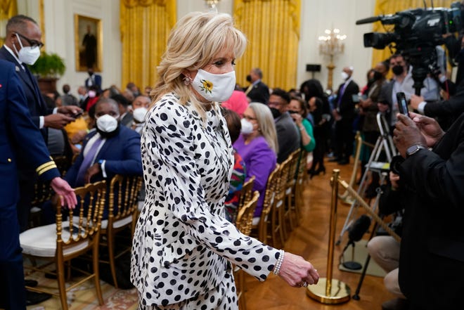 First lady Jill Biden wears a mask with a sunflower, the national flower of Ukraine, in support of the Ukrainian people at an event with President Joe Biden to celebrate Black History Month in the East Room of the White House, Feb. 28, 2022. The event took place as Ukraine fought an invasion by Russia.
