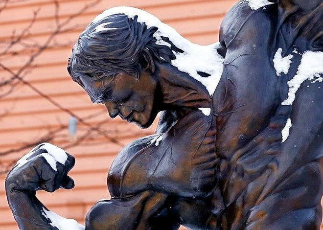 The Arnold Schwarzenegger statue collects some snow on Tuesday, February 16, 2021, at the Greater Columbus Convention Center, where the Arnold Sports Festival USA is held.