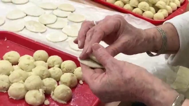 Volunteers at St. Michael's Ukrainian Catholic Church in Cherry Hill make pyrohy potato dumplings, better known as pierogi, for sale as a fundraiser