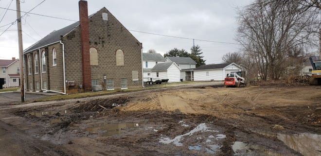 Conesville Wesleyan Church recently took possession of an adjacent lot. It will be used for parking and a shelter house. A boarded-up home on the property was demolished and brush cleared.