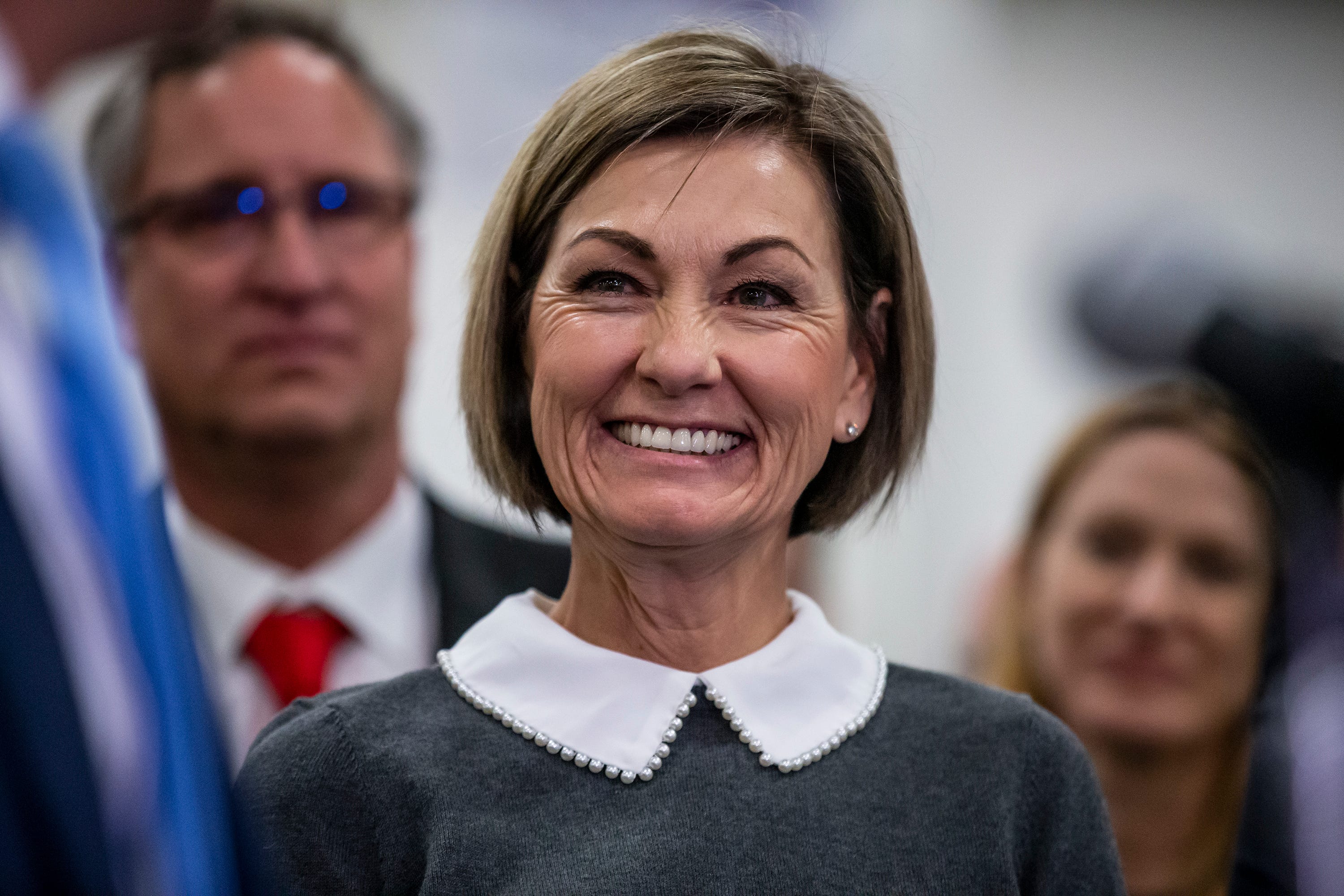 Iowa Gov. Kim Reynolds indications flat tax invoice into legislation, slicing taxes