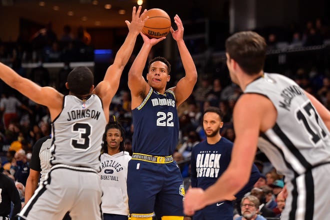 Desmond Bane (#22) of the Memphis Grizzlies takes a shot during the first half Keldon Johnson (#3) of the San Antonio Spurs at FedExForum on February 28, 2022 in Memphis, Tennessee.