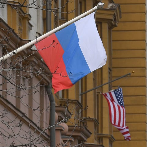 A Russian flag flies next to the U.S. Embassy in M