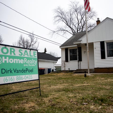 A home listed for $269,900 stands Wednesday, March