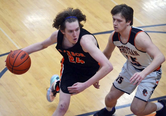 Harbor Springs' Jude Proctor (left) drives on a Cheboygan defender during Tuesday's road matchup in Cheboygan.