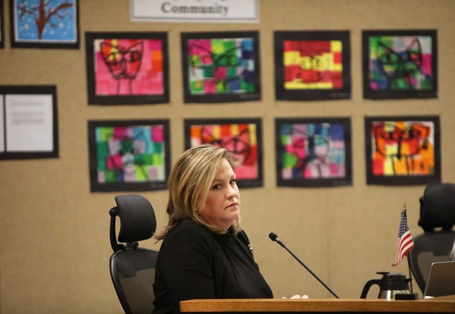 Alachua County Public Schools Superintendent Carlee Simon looks on as members of the public make comments about her as the Alachua County School Board takes up a motion to terminate her contract, during a meeting at the school board headquarters in Gainesville, March 1, 2022.