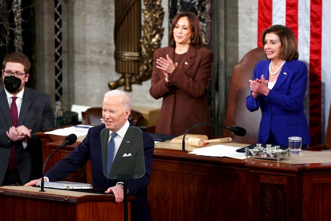 President Joe Biden delivers his first State of the Union address to a joint session of Congress at the Capitol, Tuesday, March 1, 2022, in Washington as Vice President Kamala Harris and House speaker Nancy Pelosi of Calif., applaud. (Julia Nikhinson/Pool via AP)
