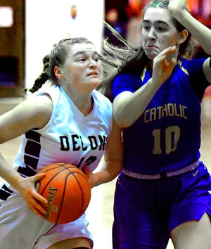Delone Catholic's Emily McCann, seen here at left in a file photo, scored 11 points on Saturday in the Squirettes' 34-28 win over Knoch.