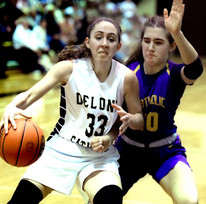 Delone Catholic's Makenna Mummert drives against Lancaster Catholic's Lily Lehman in a District 3 Class 4-A semifinal at Delone Tuesday, March 1, 2022. Delone would win 53-41. Bill Kalina photo