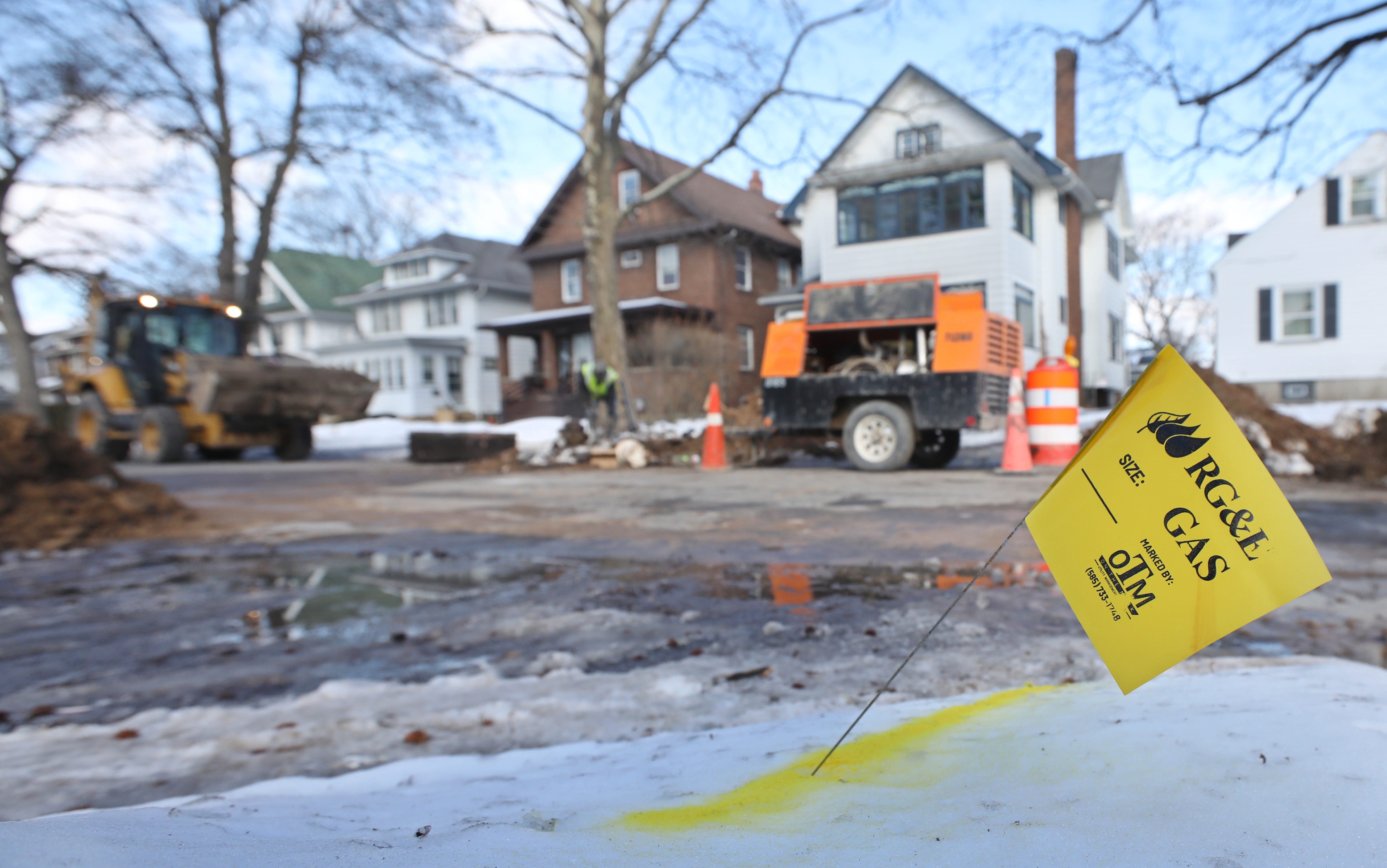 Work crews from the City of Rochester's Department of Environmental Services and the Water Bureau work at replacing lead pipes along the 200 block of Congress Avenue in Rochester Wednesday, March 2, 2022.