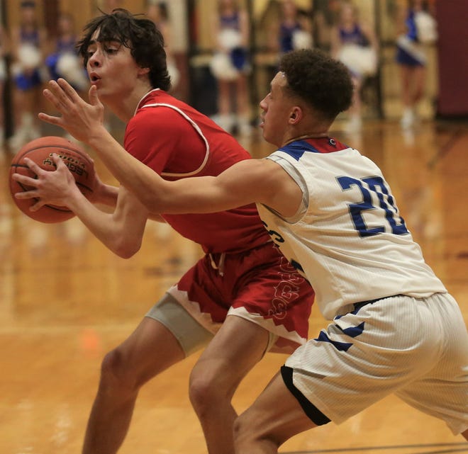 Christoval High School's Landon Scott, left, looks for an open teammate as Coleman's Braxton Smith closes in during a Class 2A boys basketball regional quarterfinal in Bronte on Tuesday, March 1, 2022.. Christoval won 52-34.