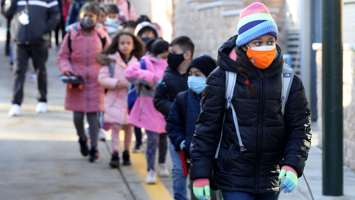 Students walk into the Church Street Elementary School in White Plains March 2, 2022. New York State's indoor mask mandate for schools was lifted on Wednesday and staff and students had the option to not wear masks for the first time since the start of the COVID-19 pandemic.