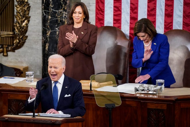 President Joe Biden, in front of Vice President Kamala Harris and House Speaker Nancy Pelosi, delivers his first State of the Union address on March 1, 2022.