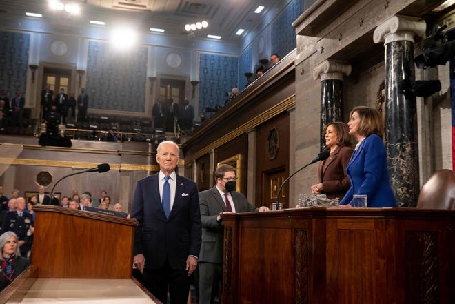 US Vice President Kamala Harris and US House Speaker Nancy Pelosi (D-CA) look on as US President Joe Biden arrives to deliver his first State of the Union address at the US Capitol in Washington, DC, on March 1, 2022.