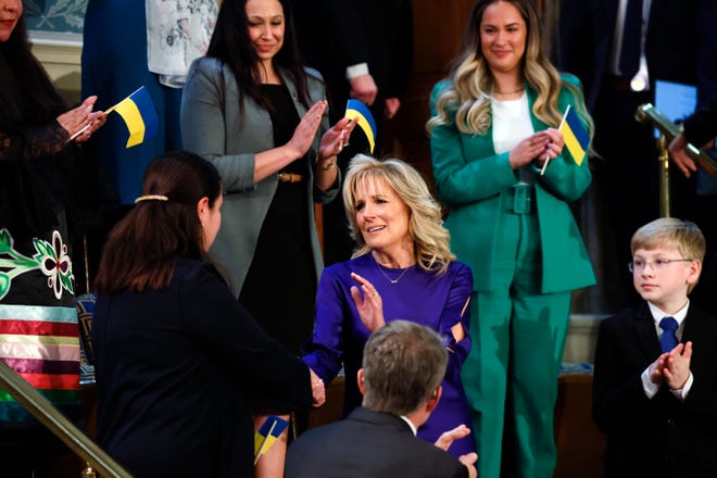 First lady Jill Biden greets her guest Ukraine Ambassador to the United States, Oksana Markarova as Markarova arrives in the first lady's box in the chamber of the House of Representatives before the State of the Union address by President Joe Biden to a joint session of Congress at the Capitol, Tuesday, March 1, 2022, in Washington.