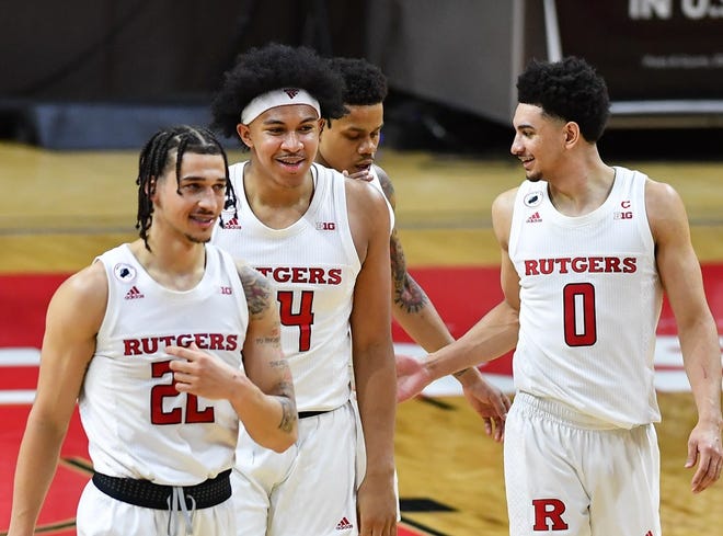 Rutgers Scarlet Knights guards Caleb McConnell (22), Ron Harper Jr. (24) and Geo Baker (0)gather together against the Northwestern Wildcats