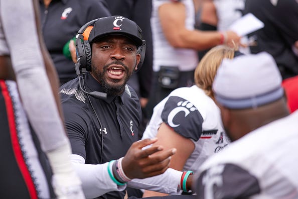 Cincinnati Bearcats defensive line coach Greg Scruggs talks to his players during a game between the Notre Dame Fighting Irish and the Cincinnati Bearcats on October 2, 2021, in South Bend, IN.